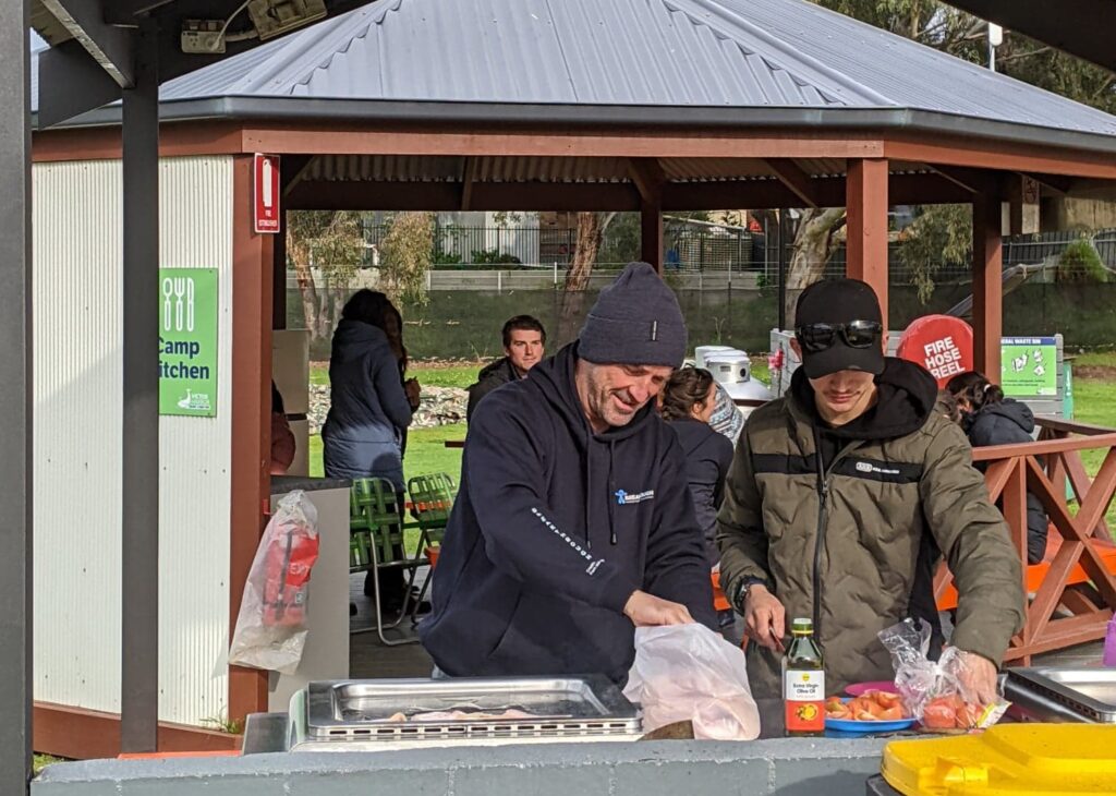 A few of the men cooking breakfast for everyone on a Church Camp.