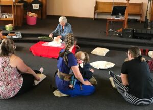 The children (and parents/ carers) listening intently during Godly Play.